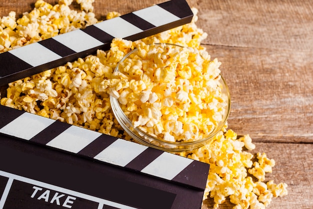 Movie clapper board and pop corn