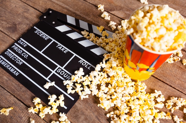 Movie clapper board and pop corn