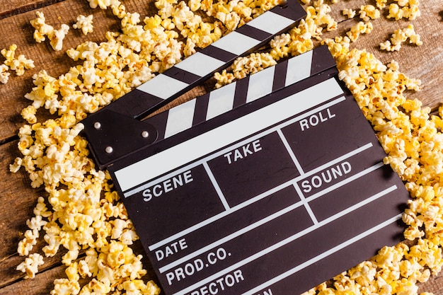 Movie clapper board and pop corn