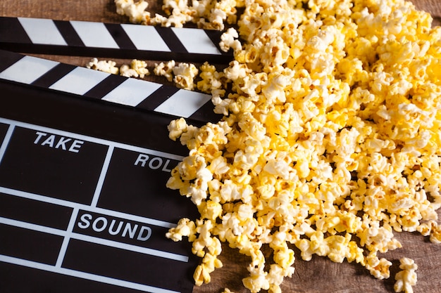 Movie clapper board and pop corn