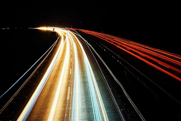 Moving car lights on highway at night long exposure