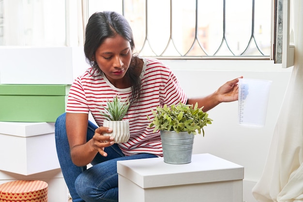 Moving in Young Indian woman unpacking in new home