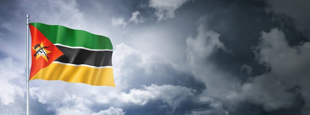 Mozambique flag on a cloudy sky