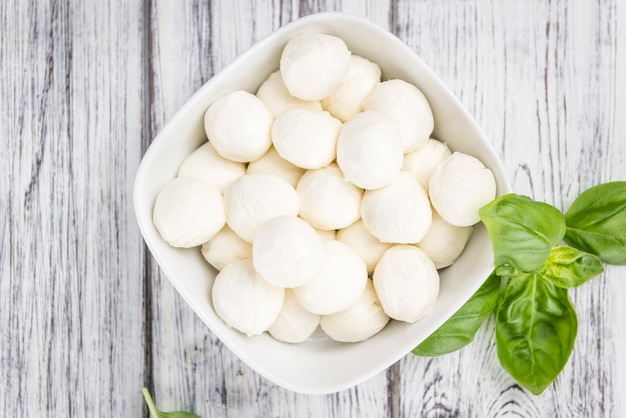 Mozzarella on wooden background