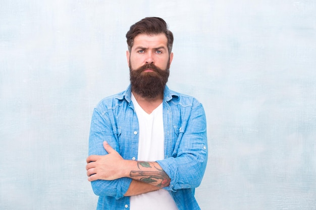 Mr Expertise Bearded man seriously tuned brutal caucasian hipster emit confidence barbershop professional Mature hipster with beard barber care Male casual fashion style Denim look