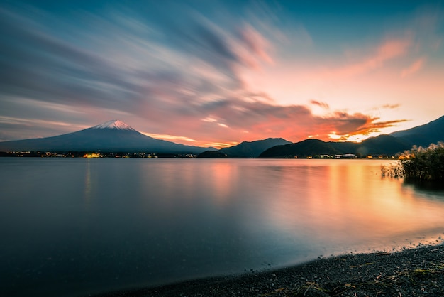 Mt. Fuji over Lake Kawaguchiko at sunset in Fujikawaguchiko, Japan.