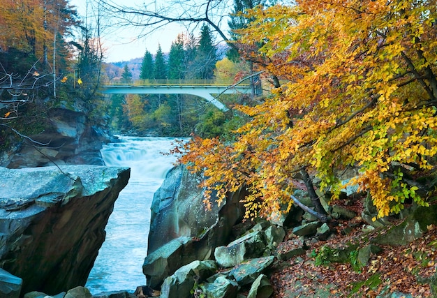 Muddy waterfall on autumn mountain Prut river (Yaremcha, Ukraine)