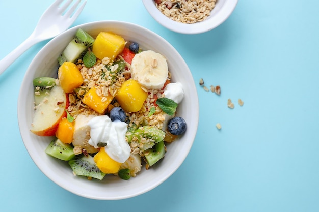 Muesli with fruits served in bowl