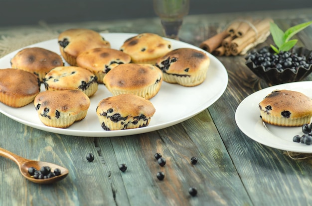 Muffin with blueberries on a wooden table Homemade blueberry muffins