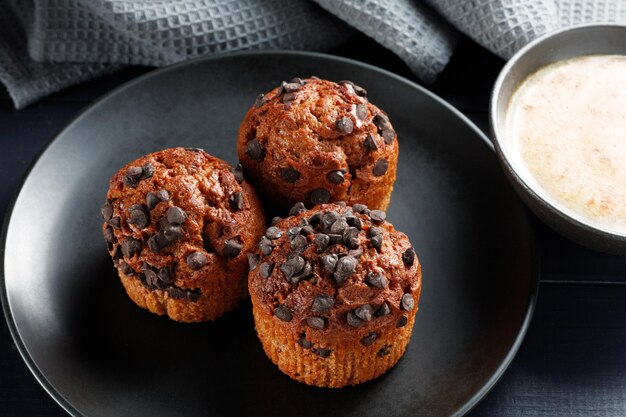 Muffins chocolate cupcakes with cappuccino