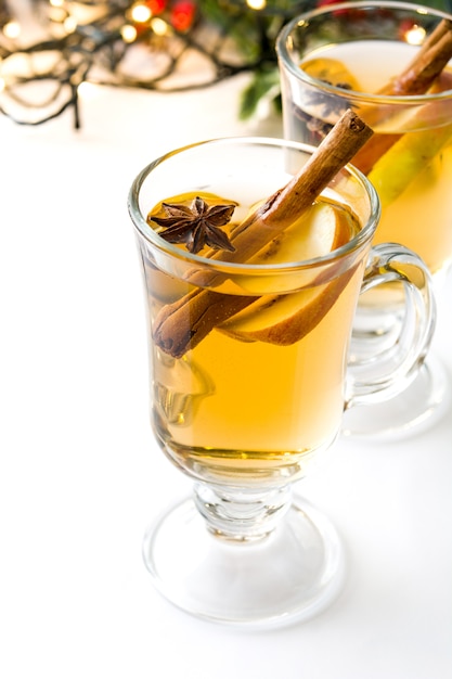 Mulled cider in glass isolated on white Christmas drink