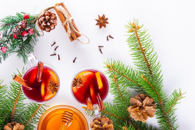 Mulled wine in glass mug with spices Glasses of mulled wine with cinnamon anise and fir tree