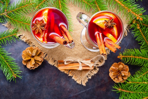 Mulled wine in glass mug with spices Glasses of mulled wine with cinnamon anise