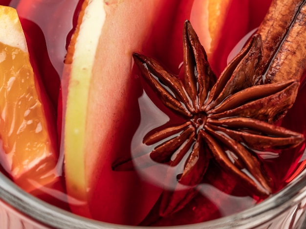 Mulled wine with spices and cinnamon sticks.