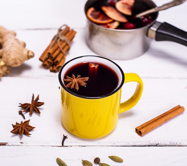 Mulled wine in a yellow mug 