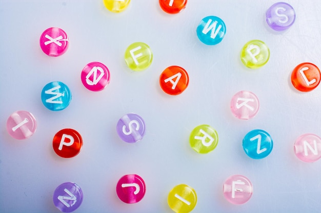 Multi color alphabet letter beads placed randomly