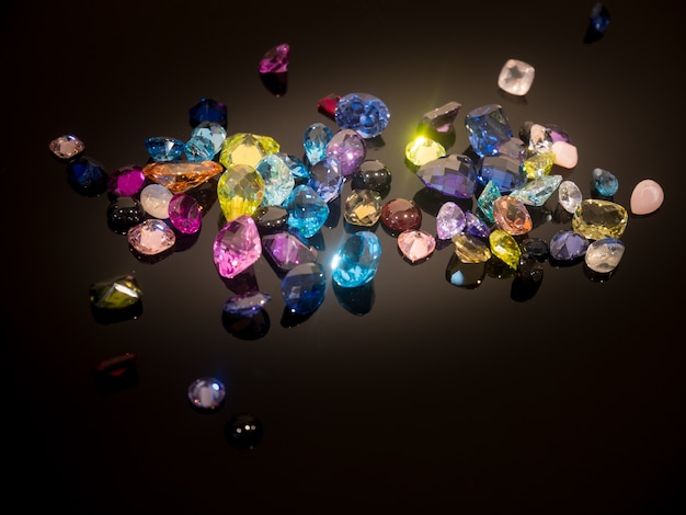 Multi Color of gemstone or gems on black shine table