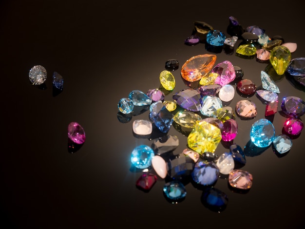 Multi Color of gemstone or gems on black shine table