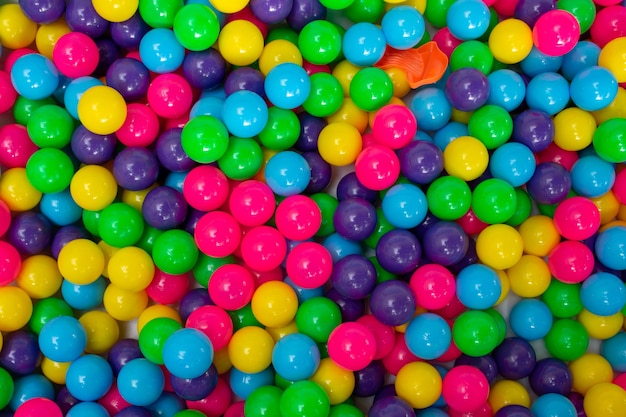 Multi color vibrant plastic ball in kids playing station.