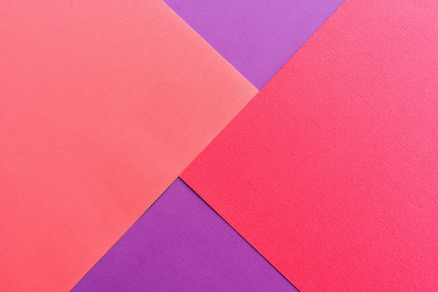 Multi colored abstract paper of pastel Pink,purple and red color palette, with geometric shape, flat lay.