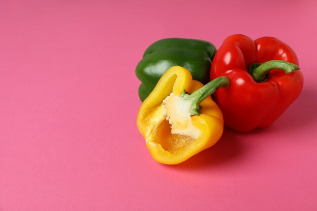 Multi-colored bell pepper on pink background