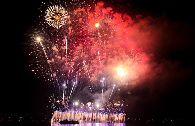 Multi-colored fireworks on the river