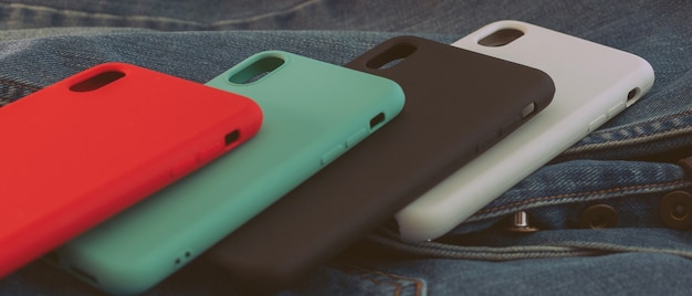 Multi-colored mobile phone case on a denim background