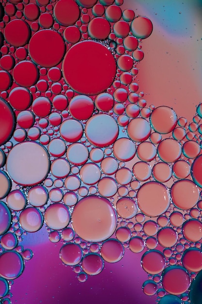 multi colored oil circles on the water, colorful background