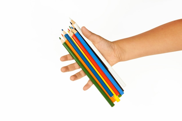 Multi-colored pencils in hand isolated