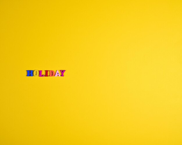 Photo multi colored text on yellow background