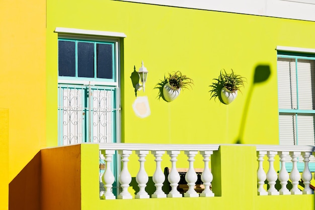 Photo multi colored windows on wall of building