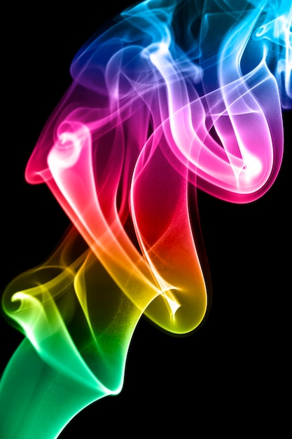 Multi-coloured smoke on a black background