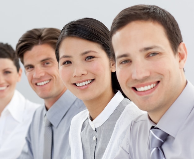 Multi-ethnic business group smiling at the camera