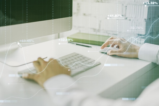 Multi exposure of abstract statistics data hologram interface with hands typing on computer keyboard on background computing and analytics concept