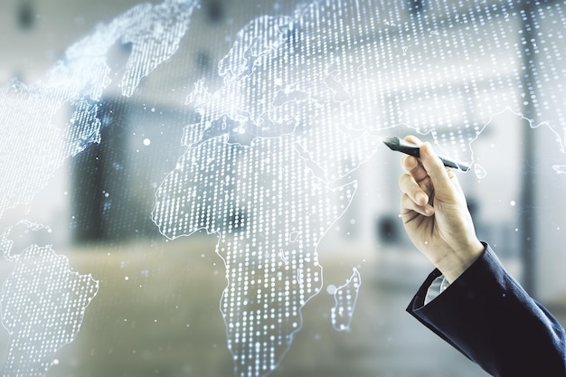 Multi exposure of man hand with pen working with abstract creative digital world map hologram on blurred office background tourism and traveling concept