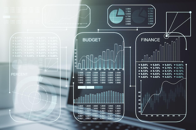 Multi exposure of stats data illustration on modern laptop background computing and analytics concept