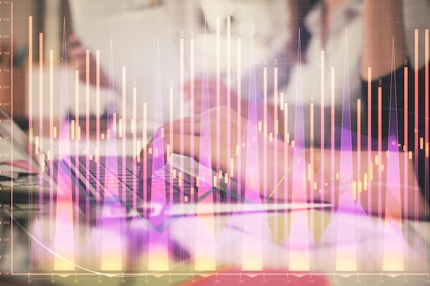 Multi exposure of woman hands typing on computer and financial graph hologram drawing Stock market analysis concept