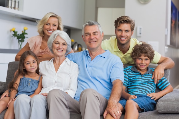 Multi-generation family posing in the living room