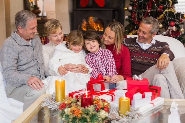 Multi generation family sitting on a couch during christmas