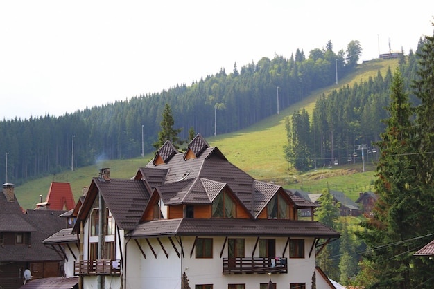 Multi pitched roof of a large private house in a suburban village in the mountains