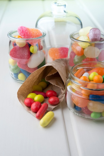 Multicolor candies in glass jars 