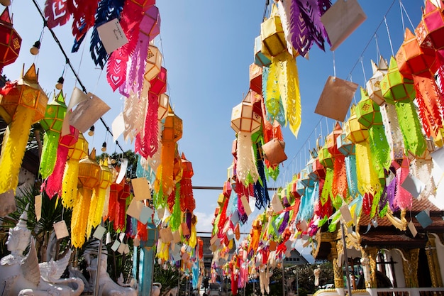 Multicolor colorful paper lamp traditional lanna style Yee peng or lighting lantern tung hang for people respect praying at outdoor in Wat Pa Daraphirom Temple at Mae Rim city in Chiang Mai Thailand