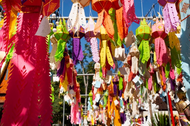 Multicolor colorful paper lamp traditional lanna style Yee peng or lighting lantern tung hang for people respect praying at outdoor in Wat Pa Daraphirom Temple at Mae Rim city in Chiang Mai Thailand