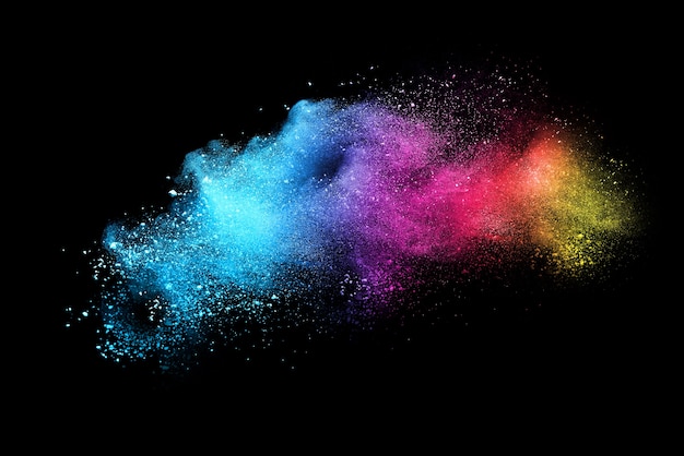 Photo multicolor powder explosion on black background. colored cloud.