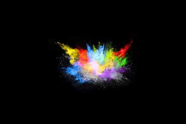 Multicolor powder explosion on black background.  