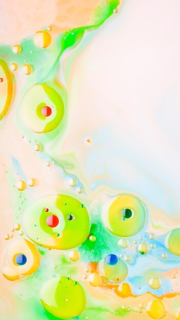 Multicolored background with oil on liquid Abstract golden green background on liquid