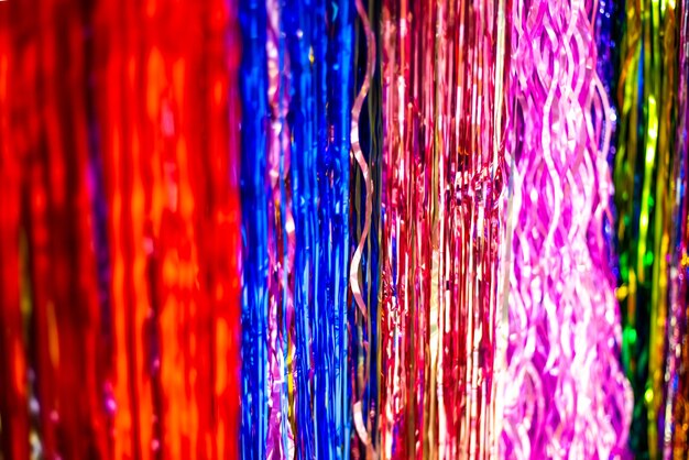 Multicolored blurred festive background made of Christmas rain.