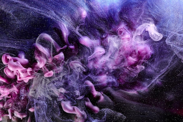 Multicolored contrast outer space abstract background clouds of interstellar smoke in motion cosmic swirl of paints