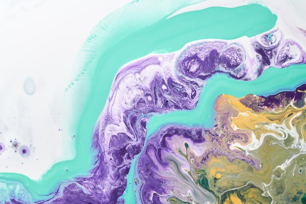 Multicolored creative abstract background Lilac alcohol ink Waves stains spots and strokes of paint marble texture