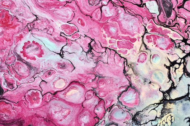 Multicolored creative abstract background Pink alcohol ink Waves stains spots and strokes of paint marble texture